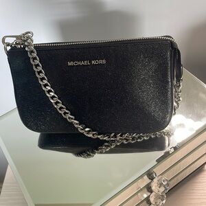 Michael Kors
Black Shiny Mini Shoulder Purse.
8X5 Inches